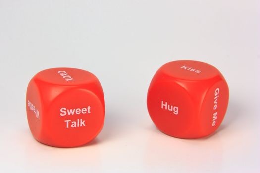 red cubes with chances to win love expression. on white