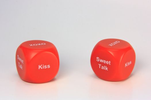 red cubes with chances to win love expression. on white