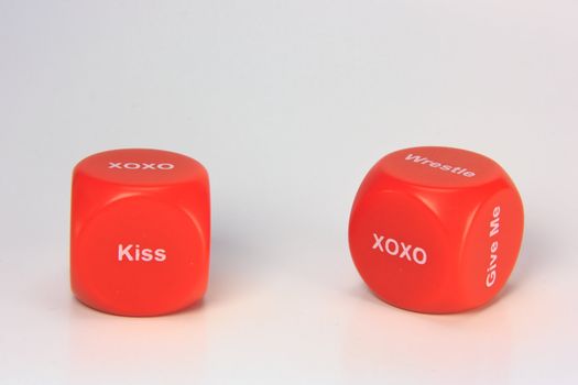 red cubes with chances to win love expression. on white