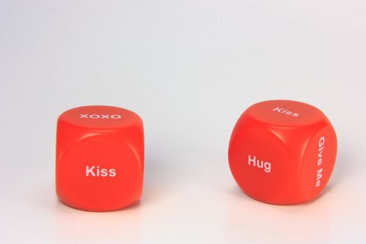 red cubes with chances to win love expression. on white