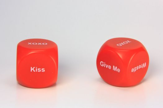 red cubes with chances to win love expression. on white