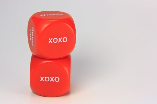 red cubes with chances to win love expression. on white