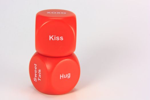 red cubes with chances to win love expression. on white