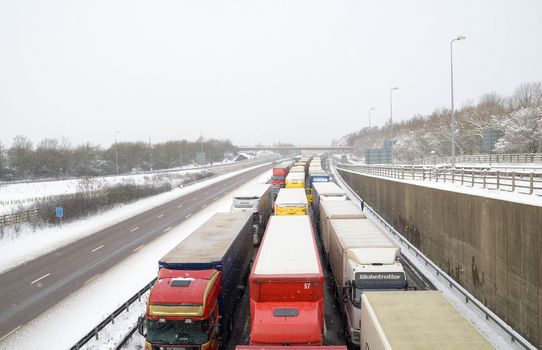 Lorries queue for as far as you can see on the m20 motorway in kent as operation stack takes effect after the channel crossings are cancelled
