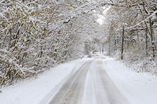 A snow covered road in kent, uk december 2010