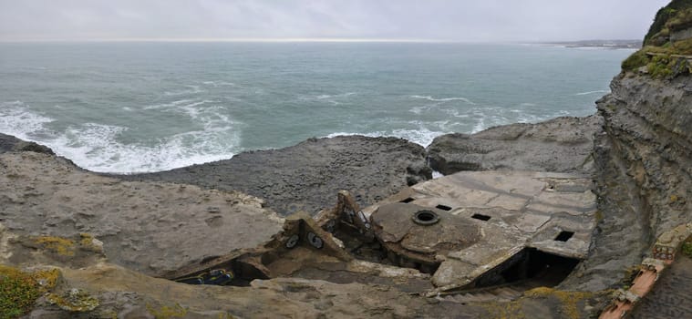 Old concrete blockhaus in a french cliff with the sea during a sad day