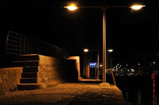 Jetty lights in the night in a little harbor