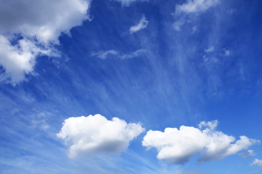 Blue sky with white cumulus clouds for background use.