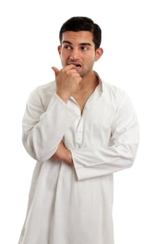 A worried, anxious or nervous man thinking.  He is wearing traditional cultural clothing.