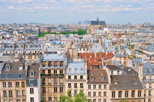 Aerial panorama above houses rooftops in a Paris