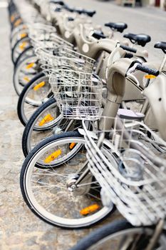 Group of bicycles on the sidewalk. Photo with tilt-shift lens