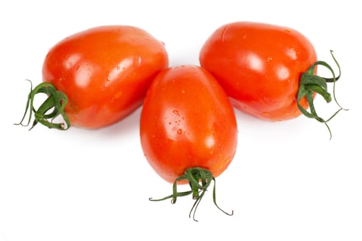 Closeup view of three tomatoes isolated on the white