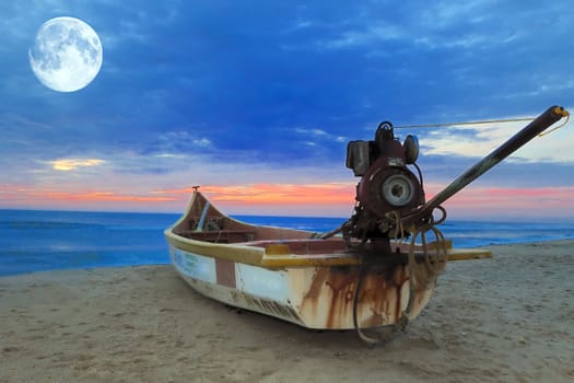 A motorized fishing boart against the morning sun