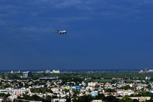A modern Asian city very densly populated and close to airport