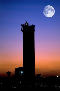 A modern lighthouse beautifully lit at dusk time