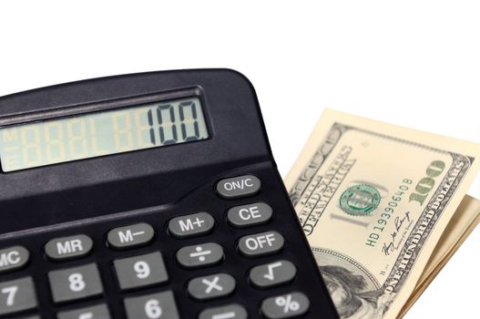 a desk calculator and dollars isolated on a white back ground