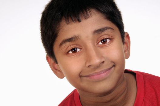 Photo of adorable young boy looking at camera