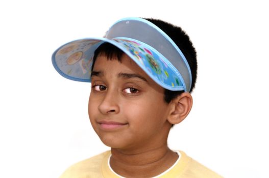 An handsome Indian kid smiling at the camera