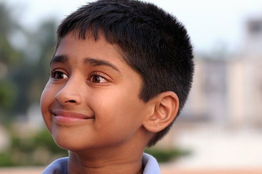 Photo of adorable young boy looking at camera