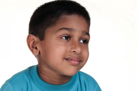 Photo of adorable young boy looking at camera