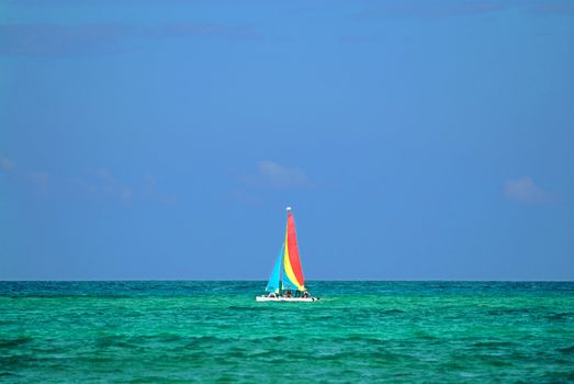 Colourful boat sailing across the carribean sea