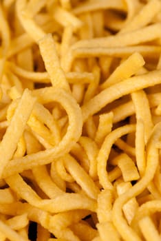 Spaetzle; traditional German noodles; a food background