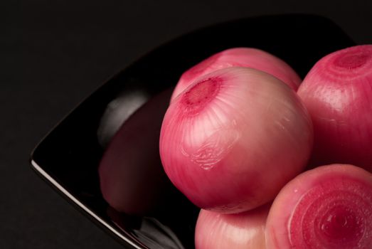 Fresh red onions pickled in vinagear, food background