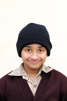 An handsome Indian kid with protective winer clothing