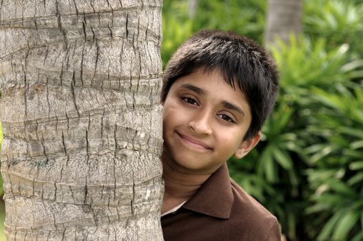 handsome indian kid looking eagerly to the camera