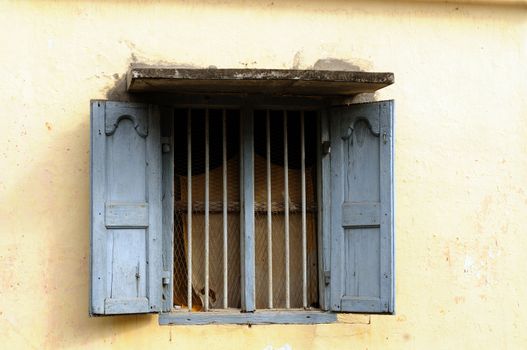 An old window on an overcast tropical summer