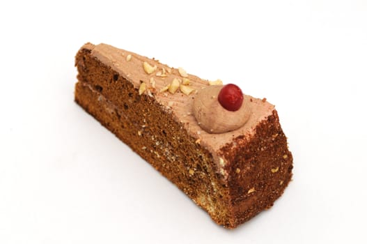 A piece of chocolate cake isolated on white
