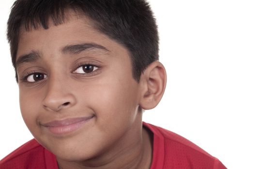 Photo of adorable young boy looking at camera