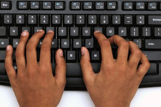 Small cute hands working on the key board