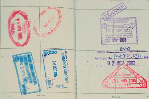 Passport immigration stamps and boarding pass, ready to travel