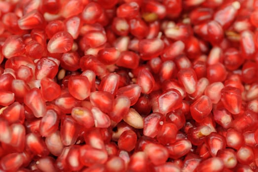 Close up shot of fresh and juicy seeds in a pomegranate