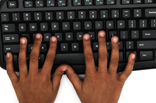 Small cute hands working on the key board