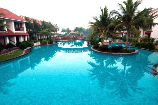 A beautiful large swimming pool at a local resort