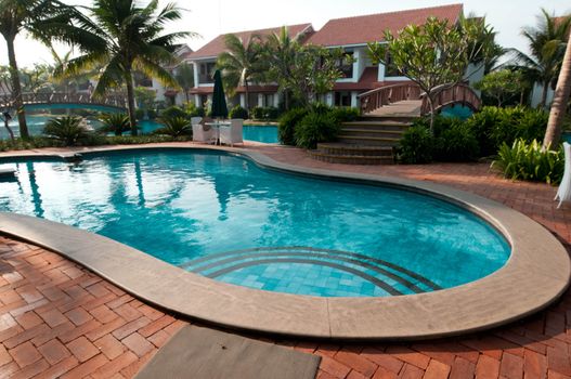 A beautiful large swimming pool at a local resort