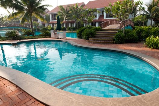 A beautiful large swimming pool at a local resort