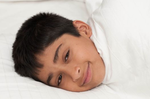 A handsome indian kid smiling for you