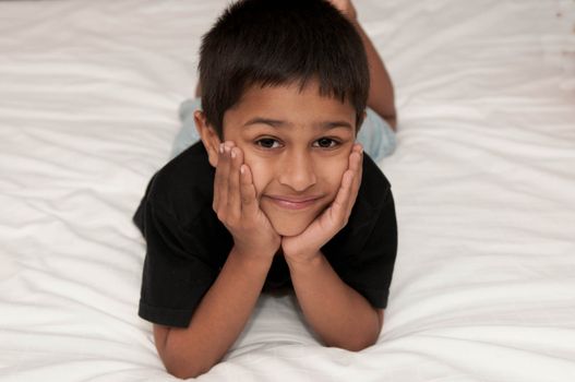 A handsome indian kid smiling for you