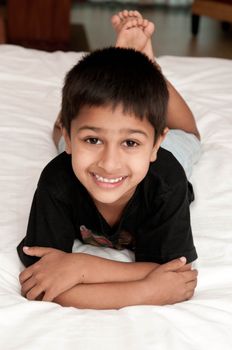 A handsome indian kid smiling for you