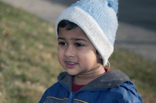 handsome indian kid eager for the spring season