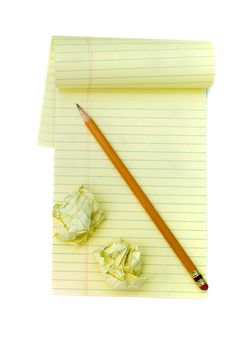 A note pad and crushed pad against a white background