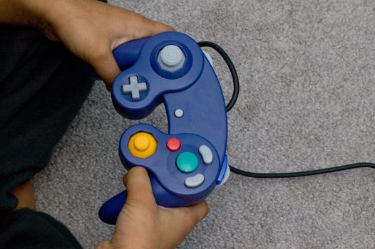 A young hands holding remote, conept of playing games