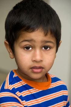 An handsome Indian kid looking sad