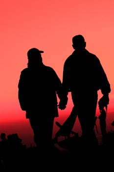 A couple enjoying sunset at the Bay bridge