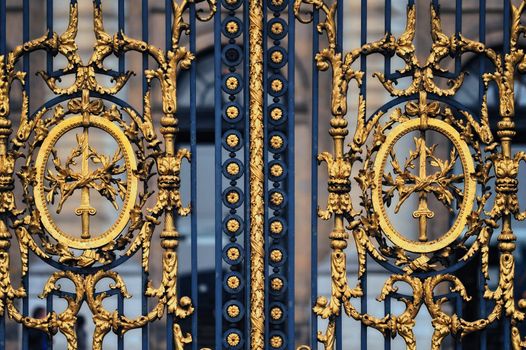 The gilt gate in classicism stile in Paris