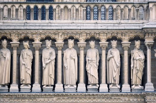 Medieval sculpture on the wall of cathedral Notre-Dame