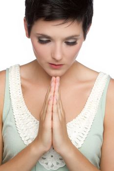 Young christian religious woman praying